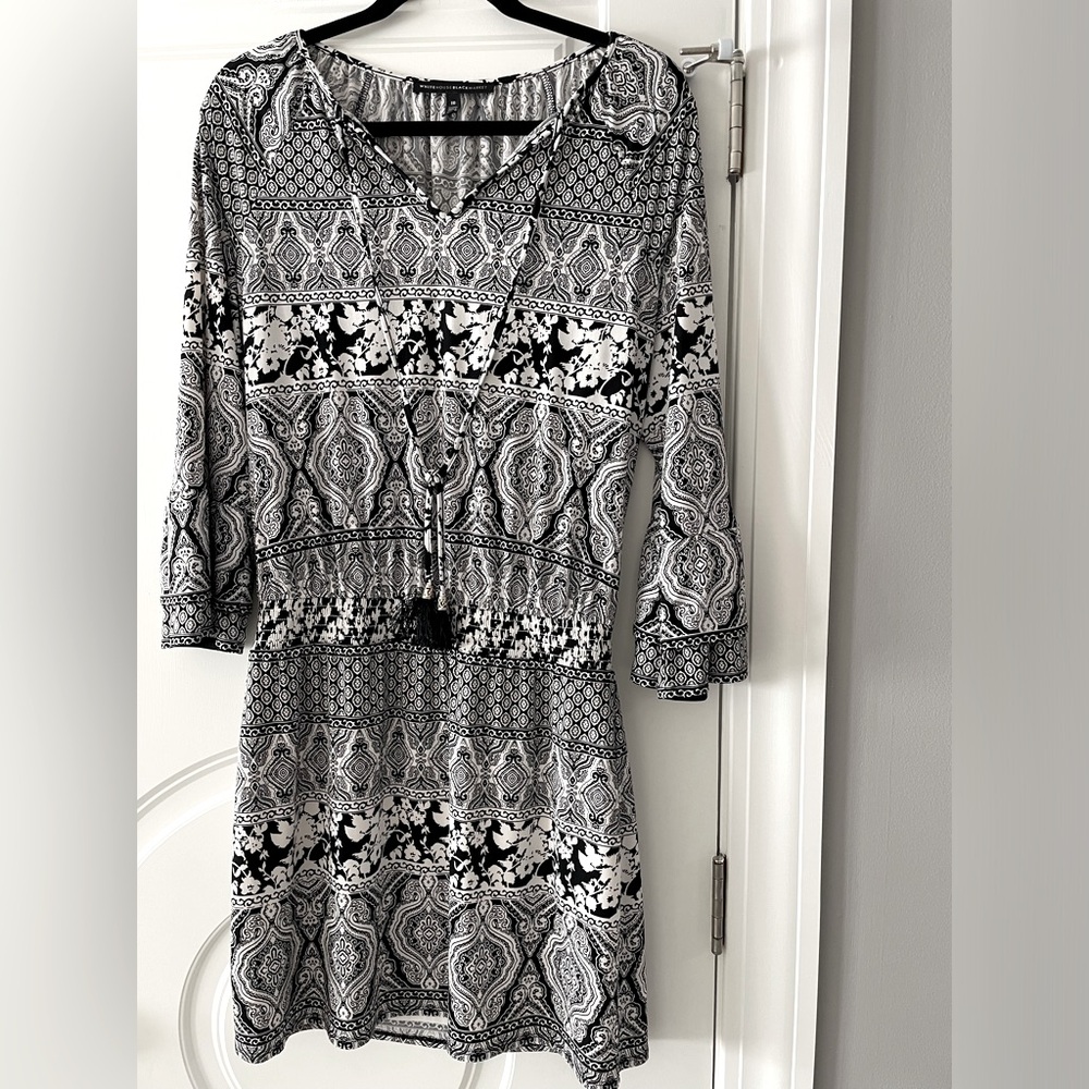 White House Black Market-  Above the knee, size 10, black and White pattern.